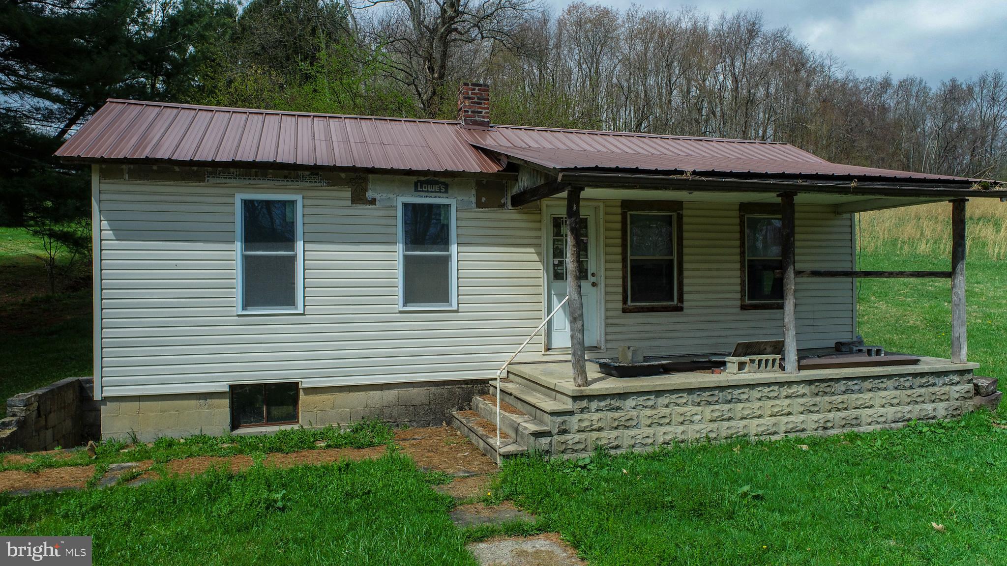 10785 Friendsville Road Friendsville, MD 21531 - Photo 5 of 19 a view of a house with a yard and sitting area