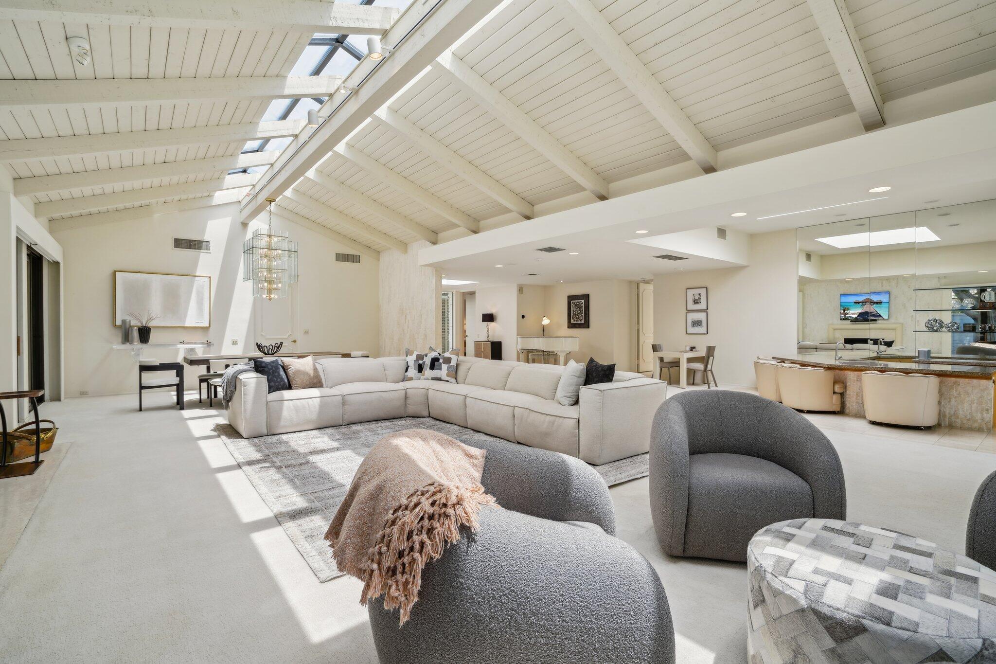 23 Park Lane Rancho Mirage, CA 92270 - Photo 11 of 57 a living room with furniture and a view of kitchen