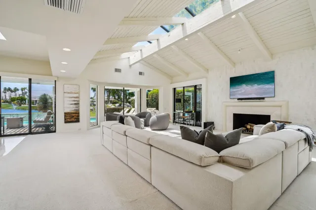 a spacious bedroom with a bed and a couch