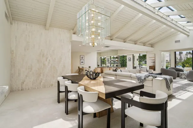 a bedroom with a bed and a chair