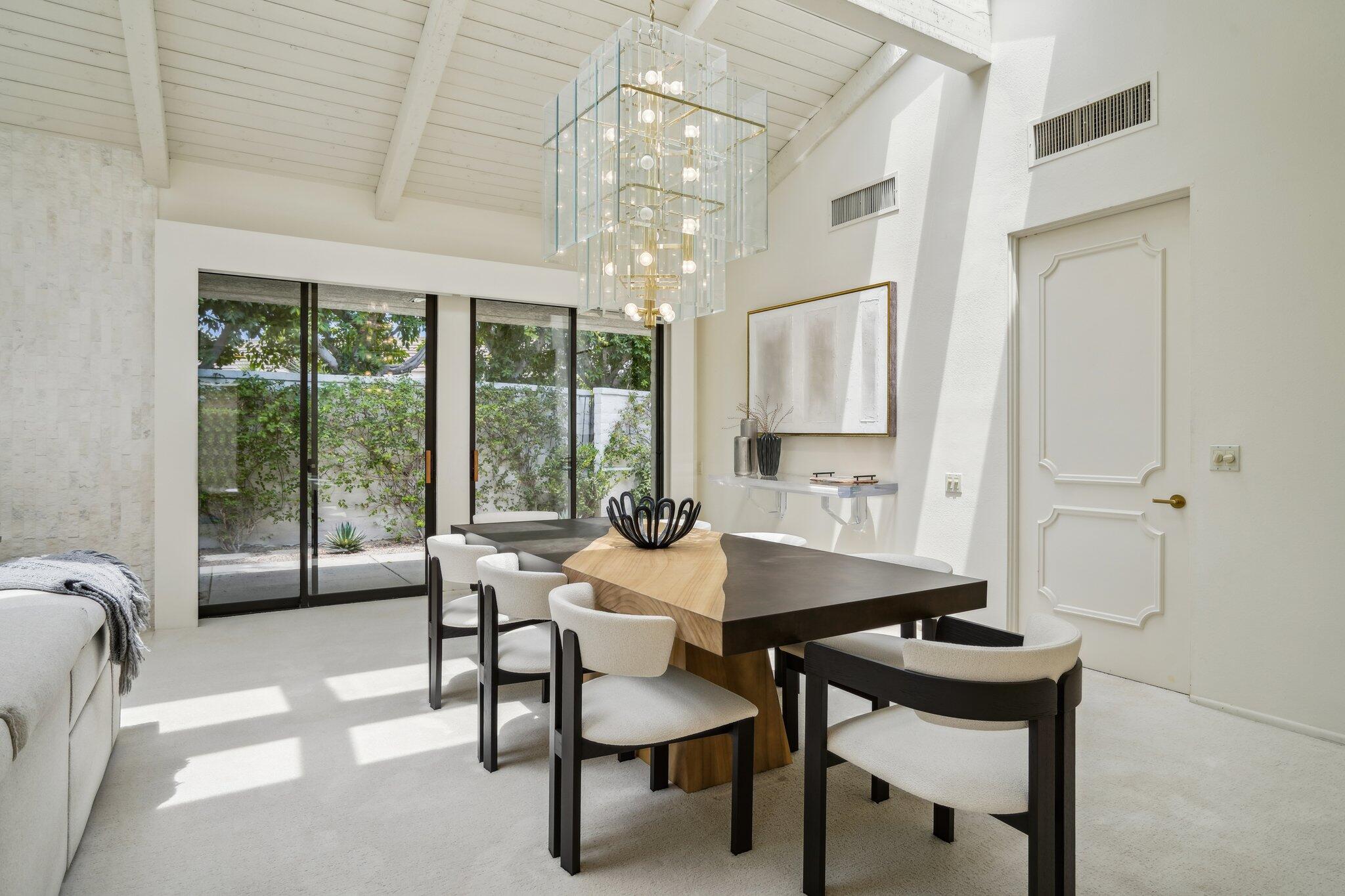 23 Park Lane Rancho Mirage, CA 92270 - Photo 15 of 57 a dining room with furniture and window