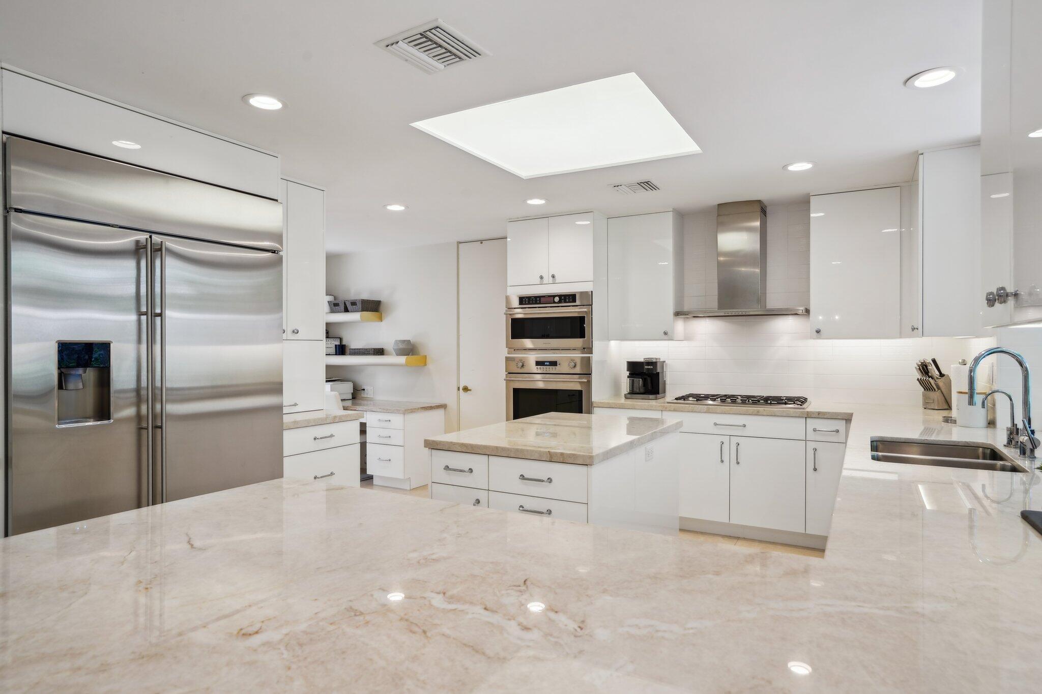 23 Park Lane Rancho Mirage, CA 92270 - Photo 29 of 57 a kitchen with stainless steel appliances a refrigerator sink and stove