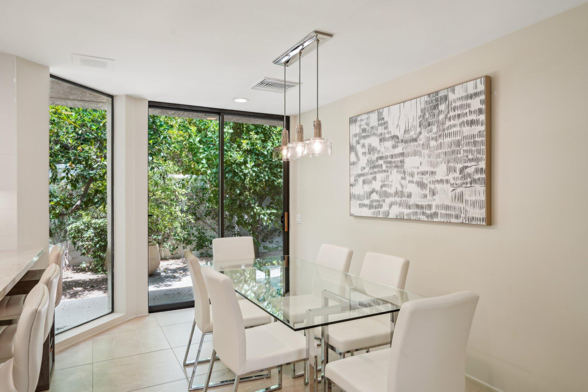 23 Park Lane Rancho Mirage, CA 92270 - Photo 30 of 57 a view of a dining room with furniture window and outside view
