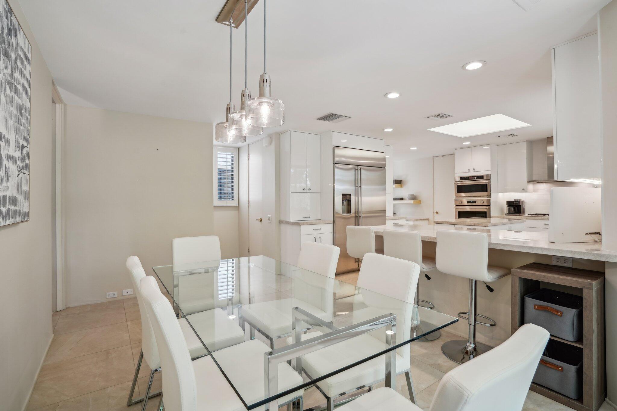 23 Park Lane Rancho Mirage, CA 92270 - Photo 31 of 57 a view of kitchen with dining area cabinets and chairs