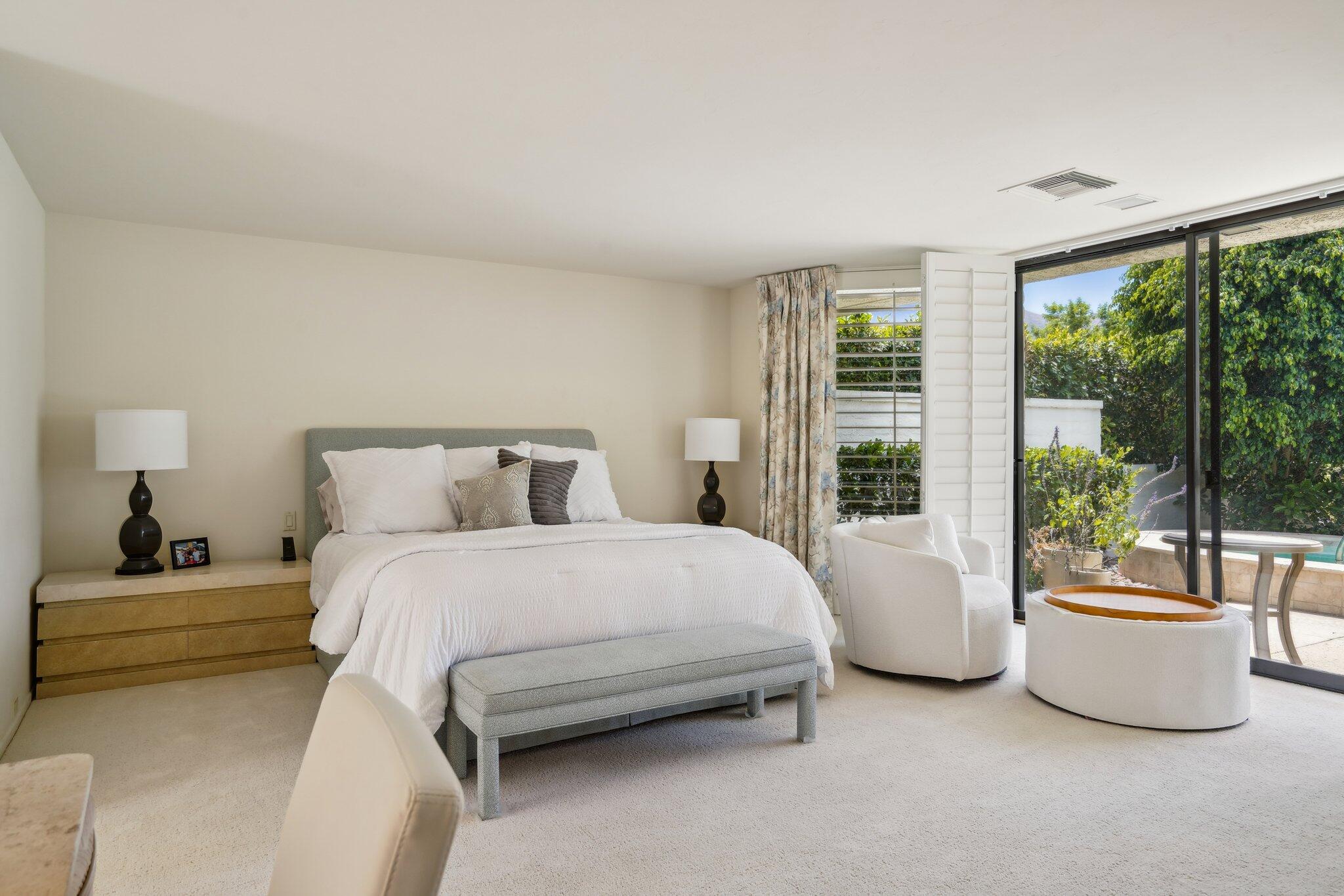 23 Park Lane Rancho Mirage, CA 92270 - Photo 35 of 57 a bedroom with a bed and a large window