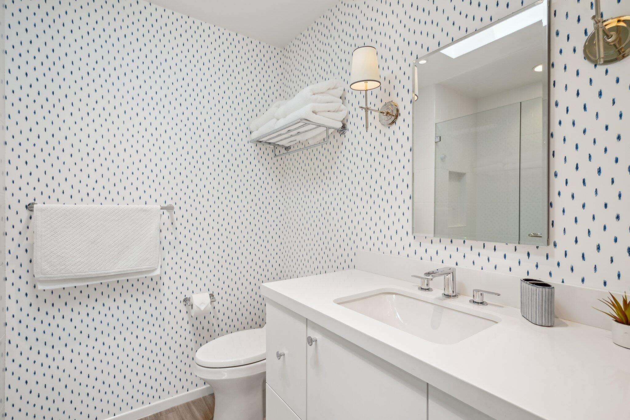 23 Park Lane Rancho Mirage, CA 92270 - Photo 42 of 57 a bathroom with a sink a toilet and a mirror