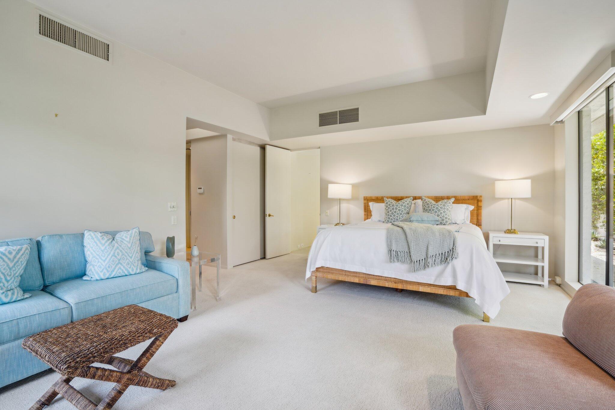 23 Park Lane Rancho Mirage, CA 92270 - Photo 50 of 57 a bedroom with a bed and a couch