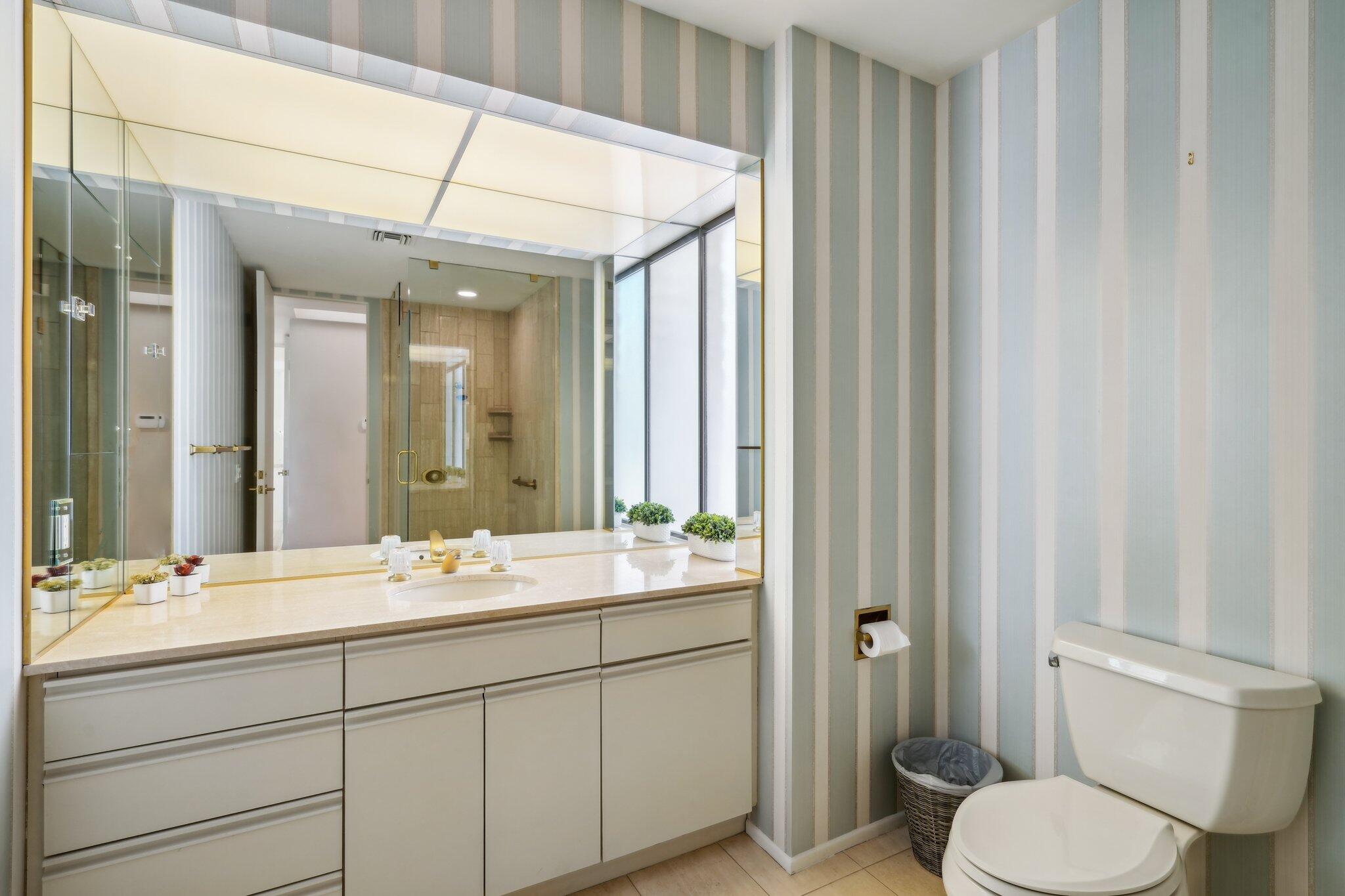 23 Park Lane Rancho Mirage, CA 92270 - Photo 52 of 57 a bathroom with a double vanity sink toilet and a mirror