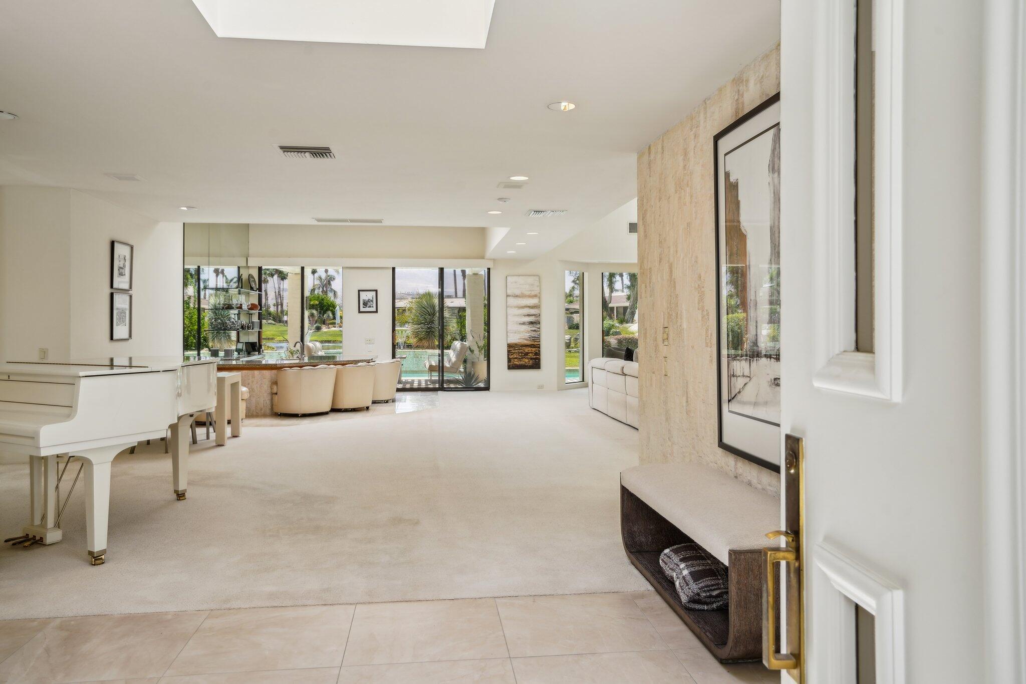 23 Park Lane Rancho Mirage, CA 92270 - Photo 7 of 57 a living room with furniture and a large window