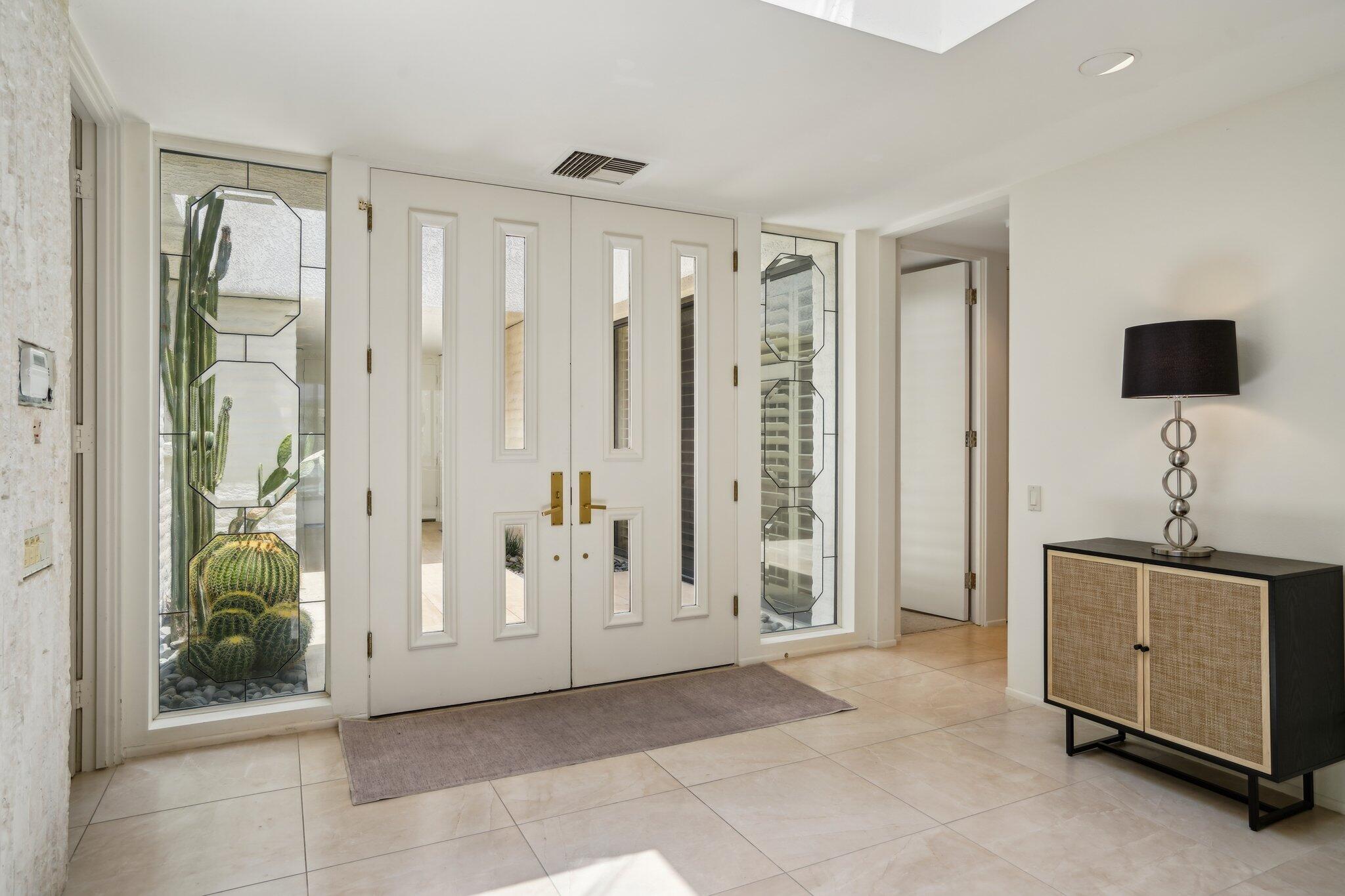 23 Park Lane Rancho Mirage, CA 92270 - Photo 8 of 57 a view of a livingroom with a chandelier