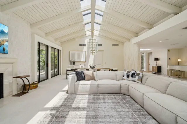 a view of a house with a backyard porch and sitting area