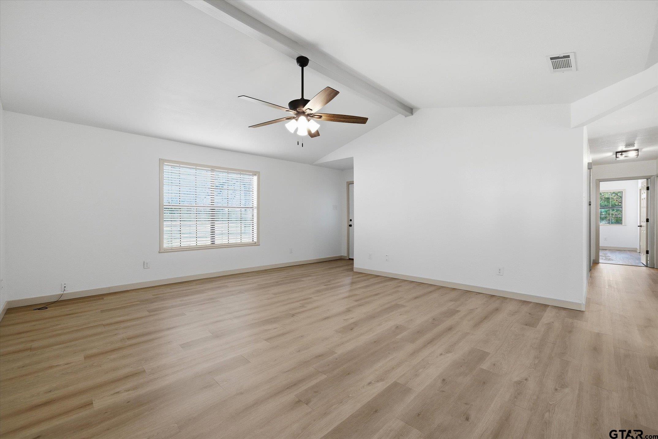 3360 Fm 1805 Van, TX 75790 - Photo 13 of 46 wooden floor in an empty room with a window
