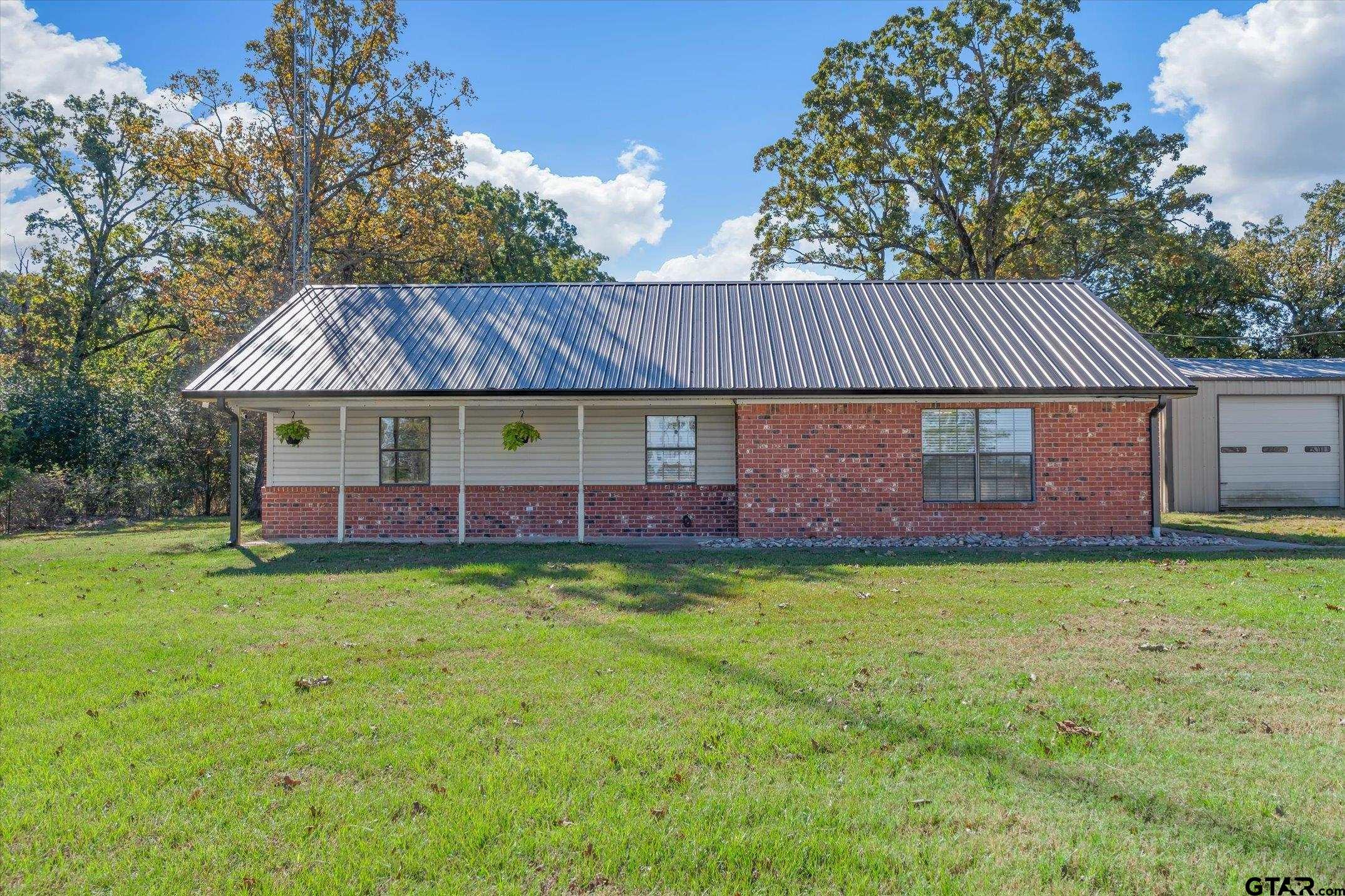 3360 Fm 1805 Van, TX 75790 - Photo 29 of 46 a view of a house with a yard and sitting area