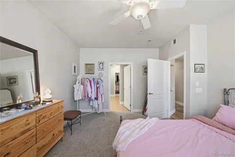 a bathroom with a double vanity sink mirror and toilet