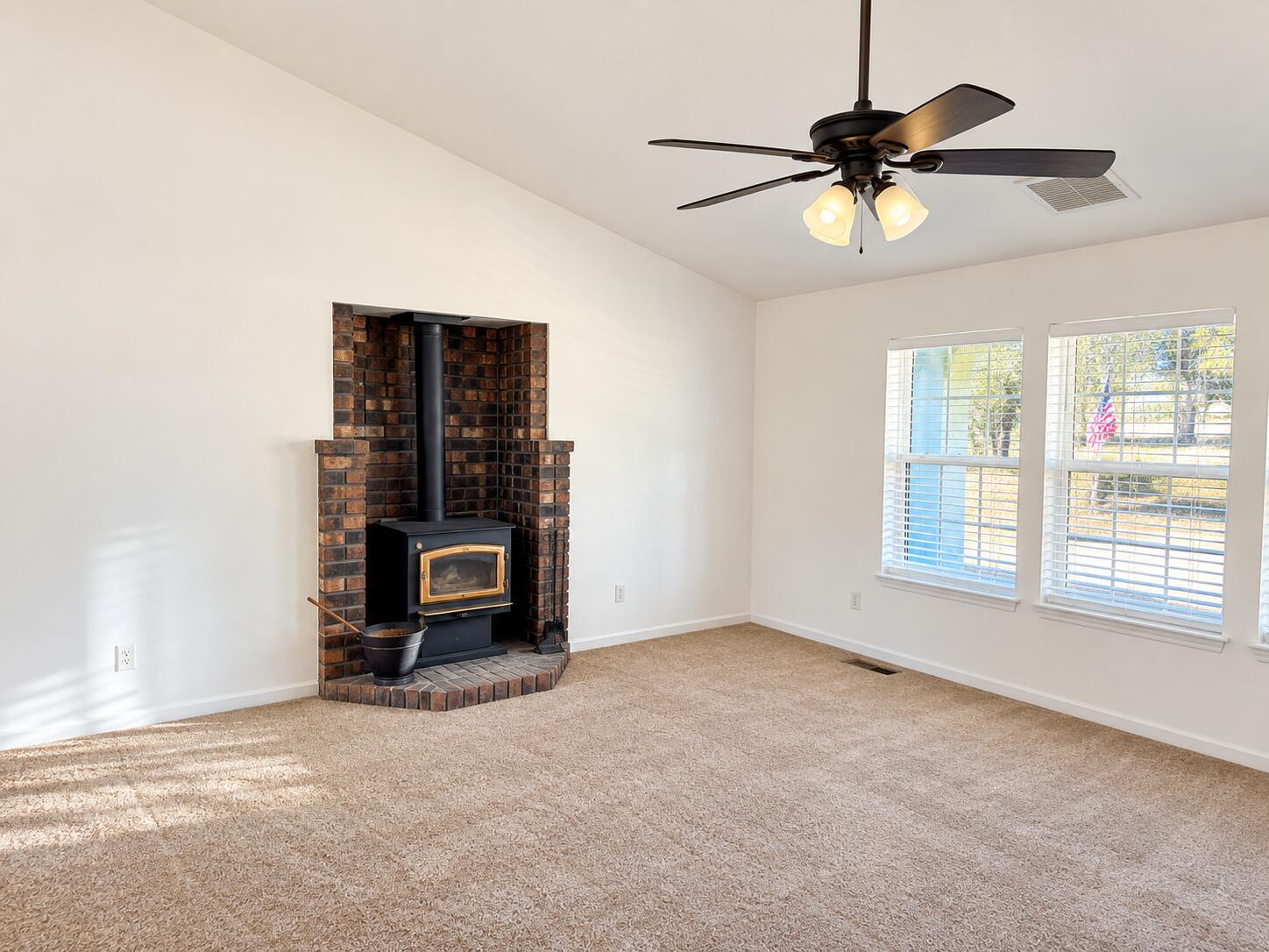 13725 Gas Point Road Igo, CA 96047 - Photo 17 of 23 Sunlit Living Room with Brick Fireplace