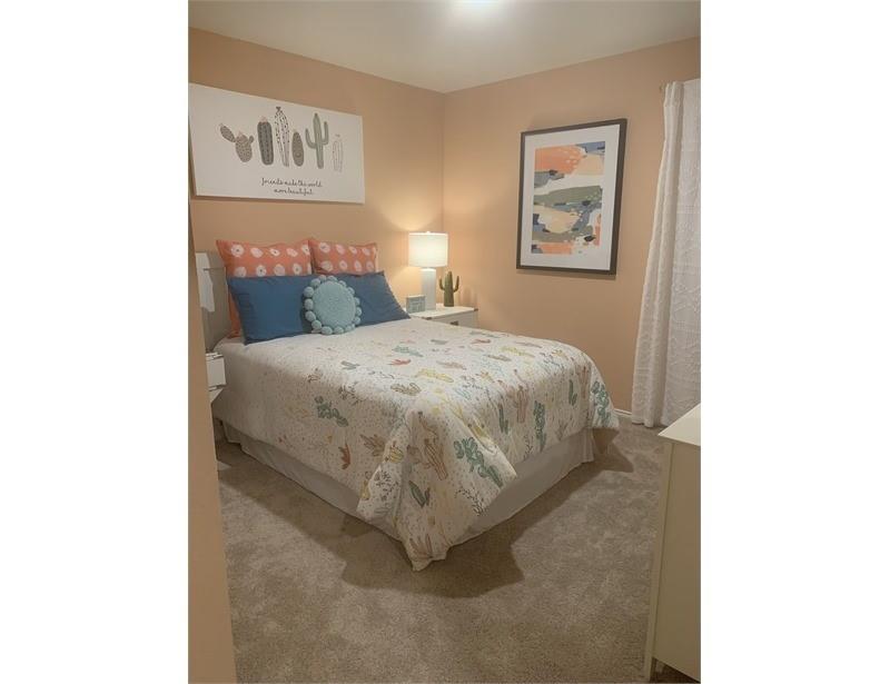 2226 Nightgrove Circle Crandall, TX 75114 - Photo 13 of 19 a bedroom with a bed and painting on the wall