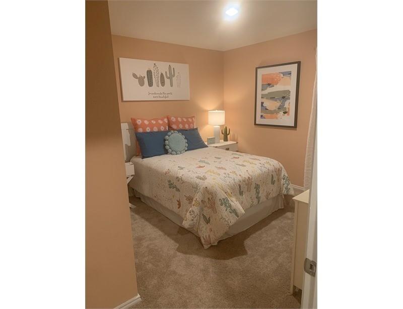 2226 Nightgrove Circle Crandall, TX 75114 - Photo 14 of 19 a bedroom with a bed and painting on the wall