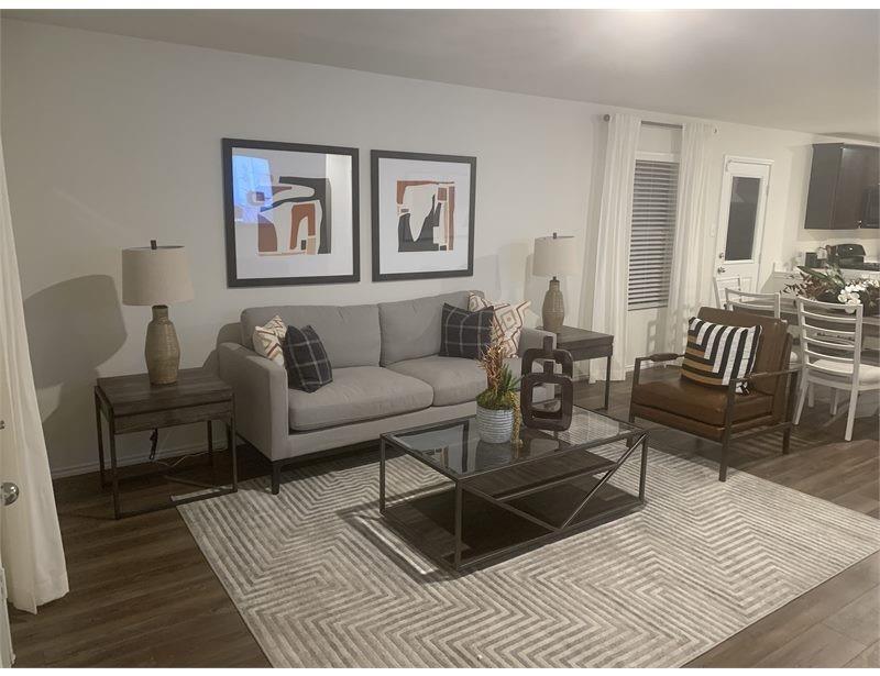2226 Nightgrove Circle Crandall, TX 75114 - Photo 16 of 19 a living room with furniture a rug and a table