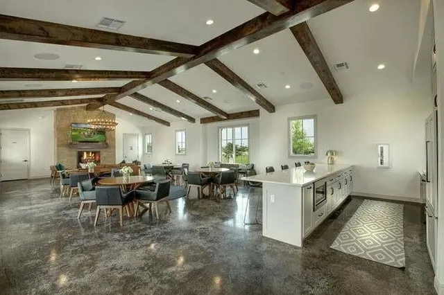 a living room with lots of furniture and white walls