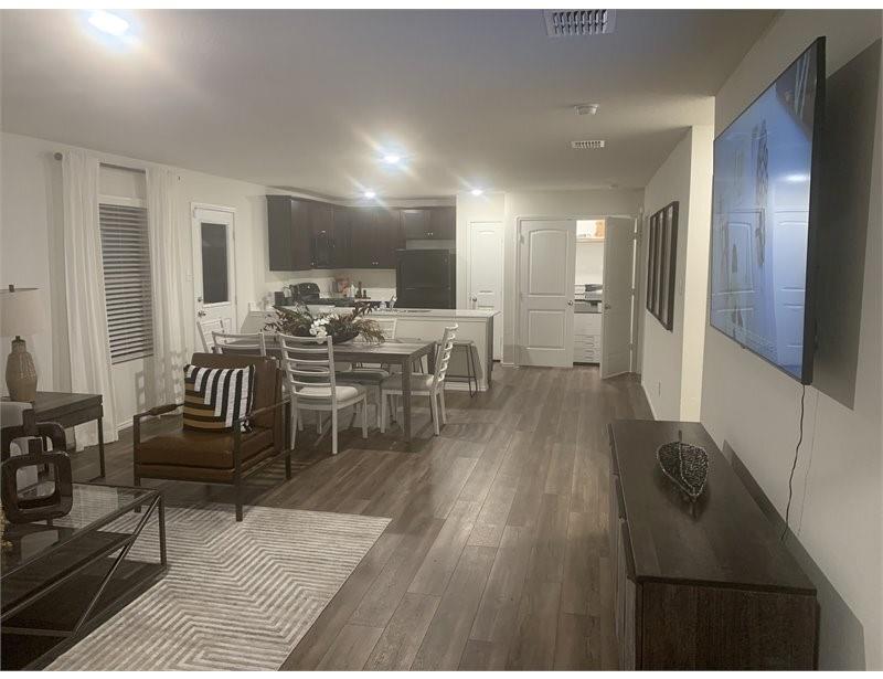2226 Nightgrove Circle Crandall, TX 75114 - Photo 8 of 19 a living room with furniture and a wooden floor