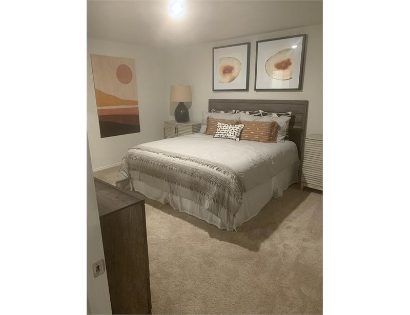 2226 Nightgrove Circle Crandall, TX 75114 - Photo 9 of 19 a bedroom with a bed and painting on the wall