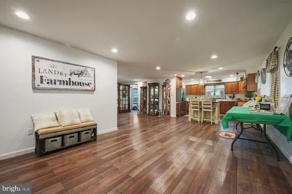 a living room with furniture fireplace and flat screen tv