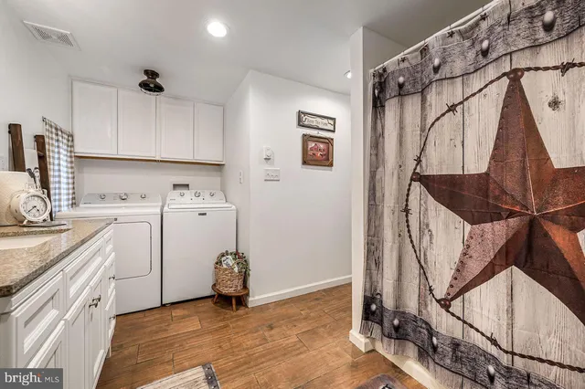 a spacious bedroom with a bed and furniture
