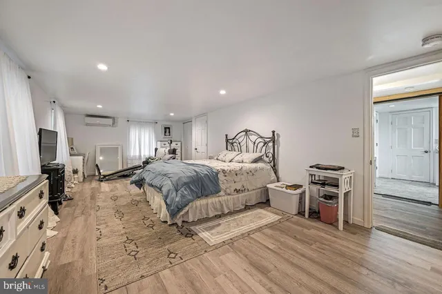 a spacious bathroom with double vanity and a mirror