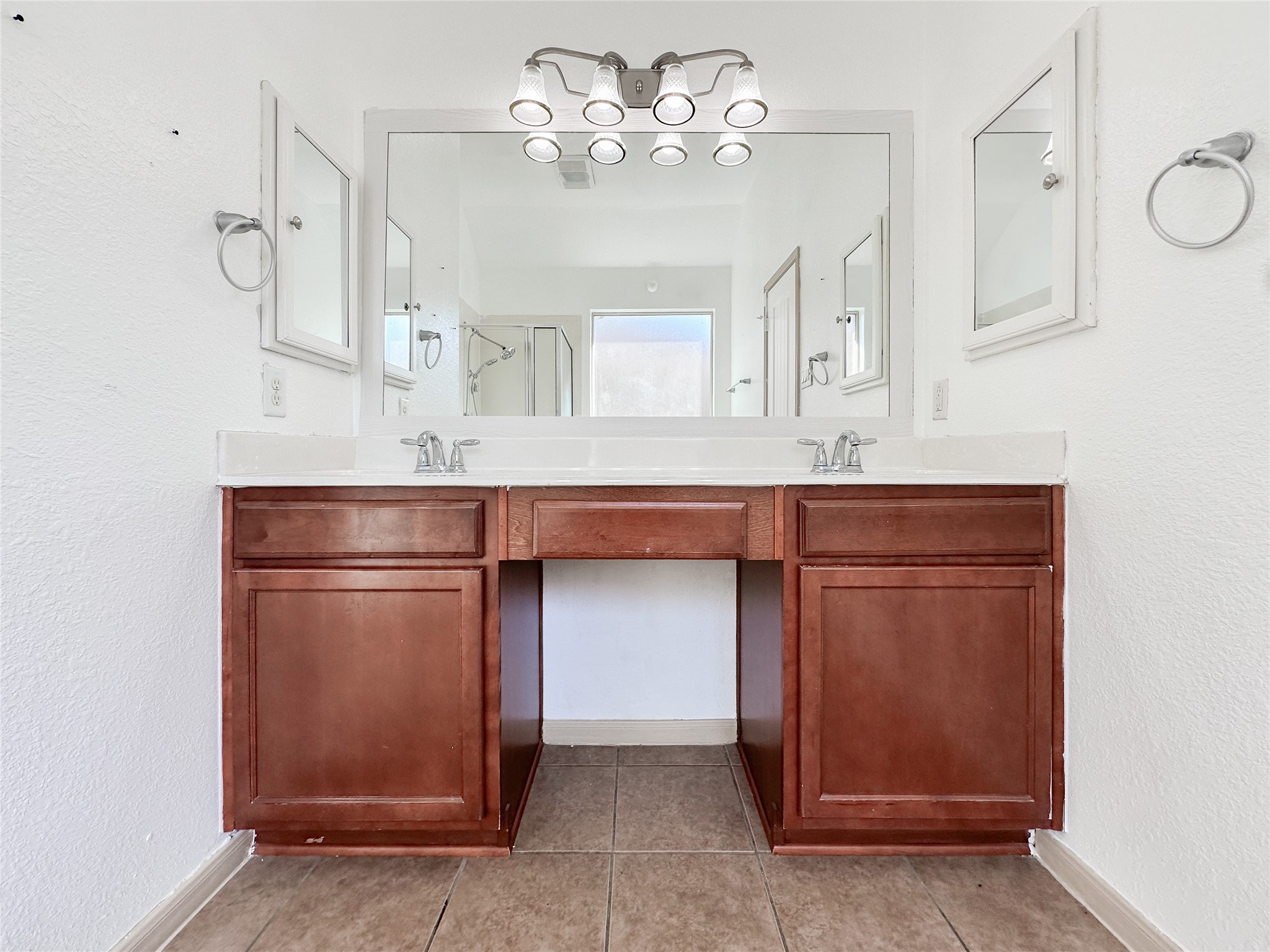 20319 Little Wing Drive Spring, TX 77388 - Photo 34 of 49 a room with cabinets a chandelier fan and a sink