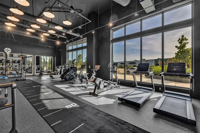 a view of a lobby with gym equipment