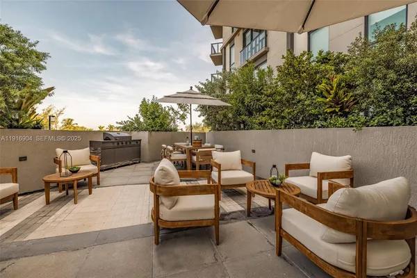 a outdoor living space with furniture and city view