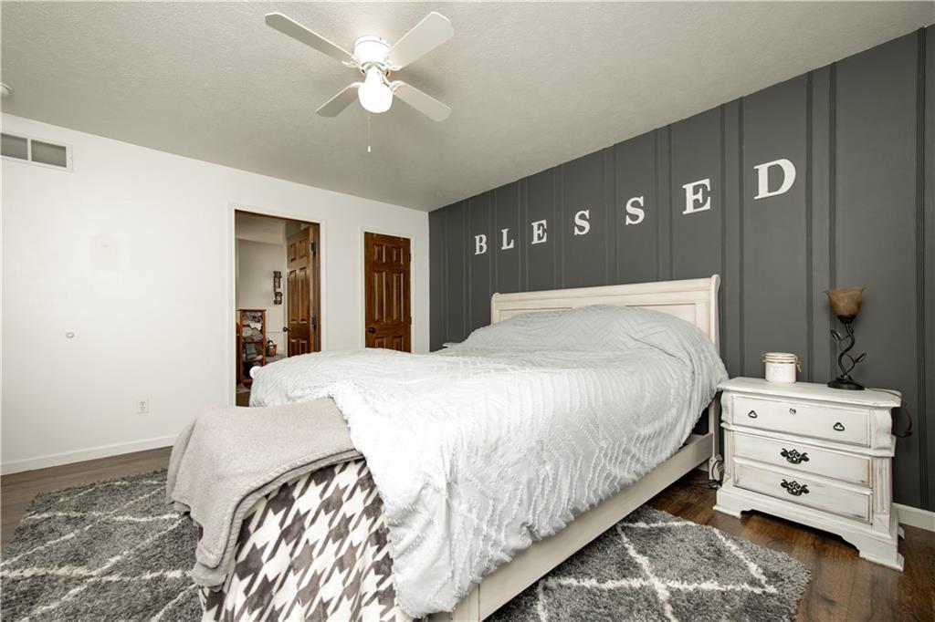 200 Shields Road Slippery Rock, PA 16057 - Photo 21 of 43 a bedroom with a bed and a ceiling fan