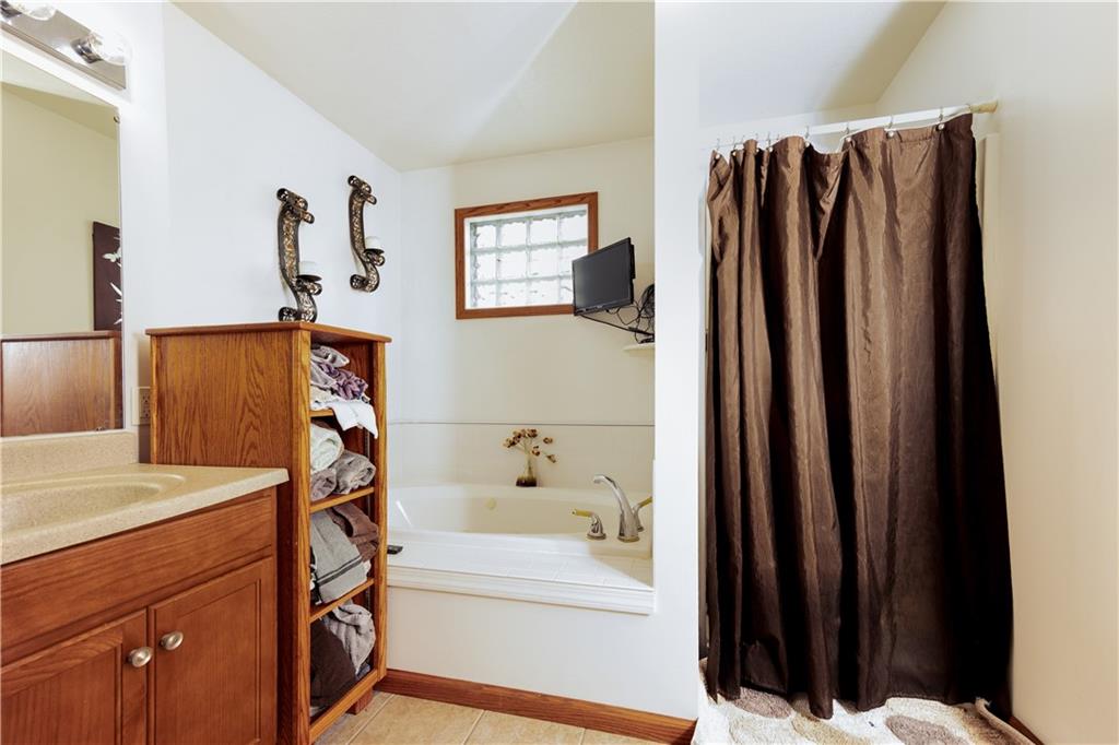 200 Shields Road Slippery Rock, PA 16057 - Photo 22 of 43 a bathroom with a bathtub and a mirror
