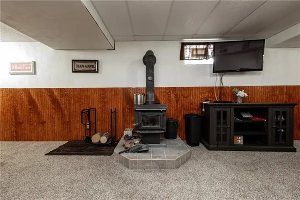 a view of a livingroom with furniture and a garage