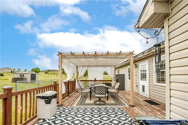 a balcony with table and chairs