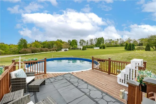 a view of a swimming pool with a patio
