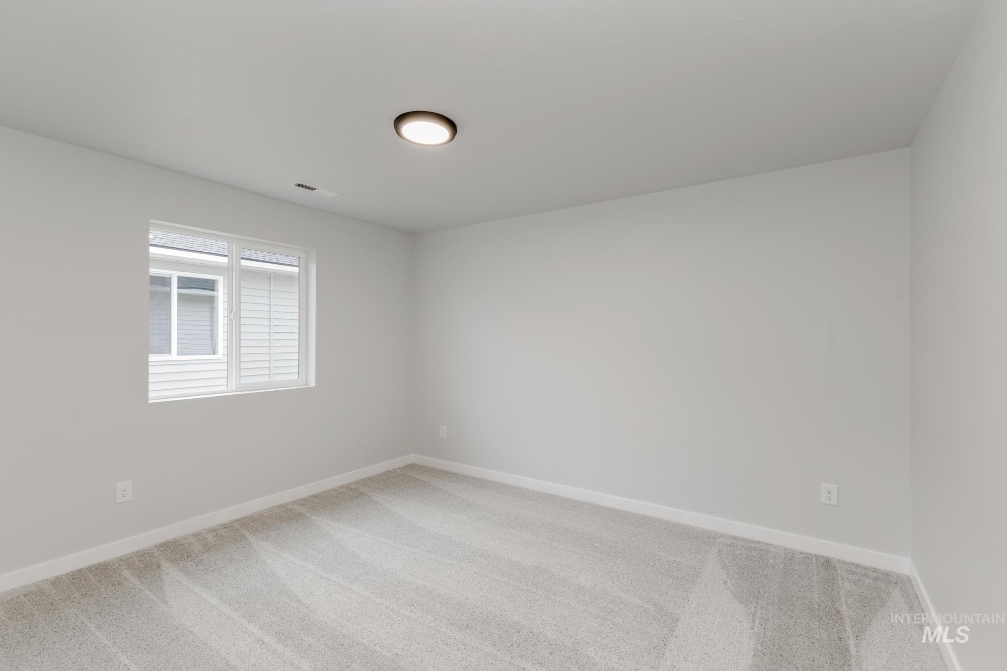 16329 Fill Avenue Caldwell, ID 83607 - Photo 11 of 18 Spare room featuring carpet flooring
