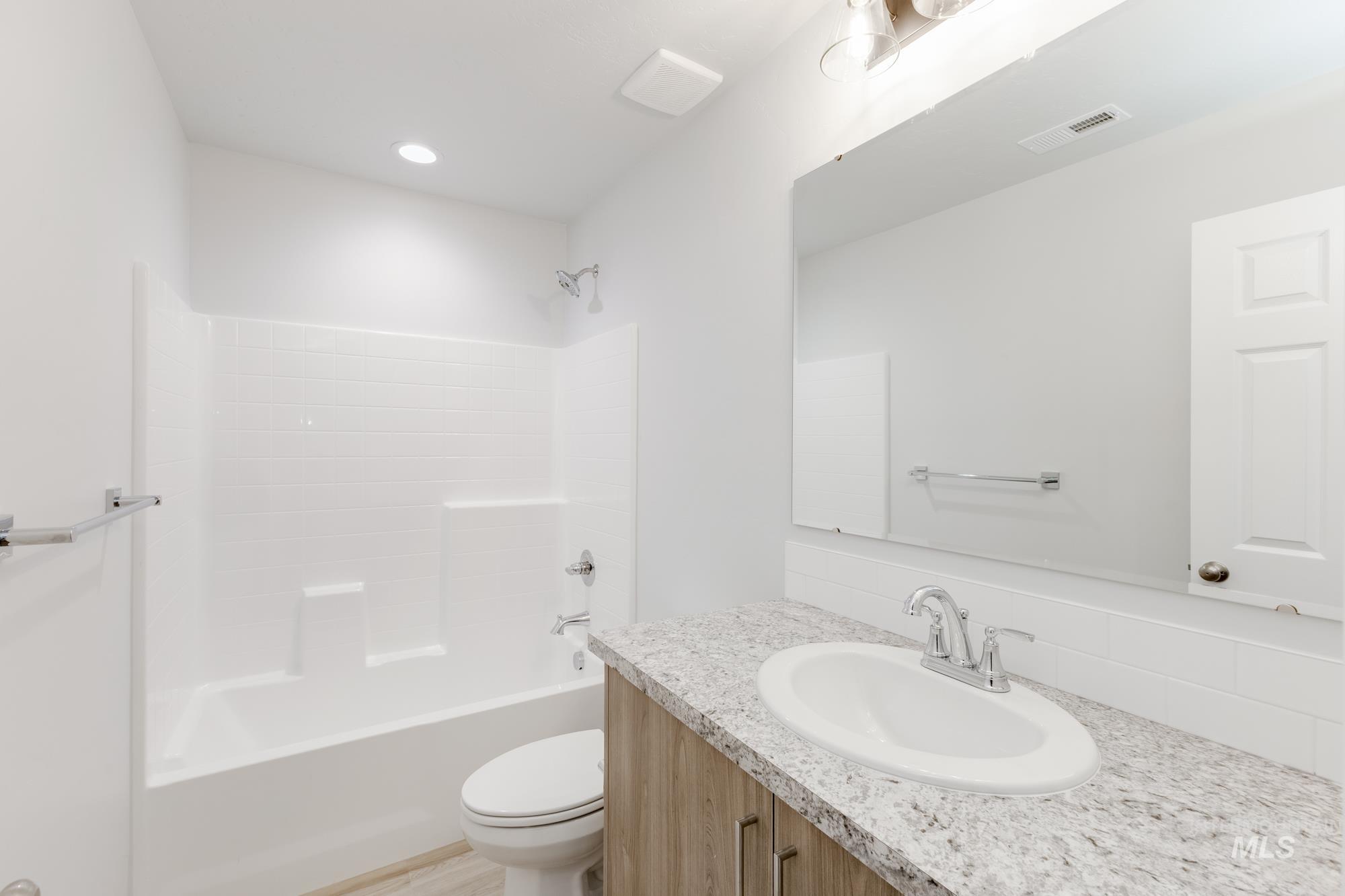 16329 Fill Avenue Caldwell, ID 83607 - Photo 13 of 18 Bathroom with bathtub / shower combination and vanity