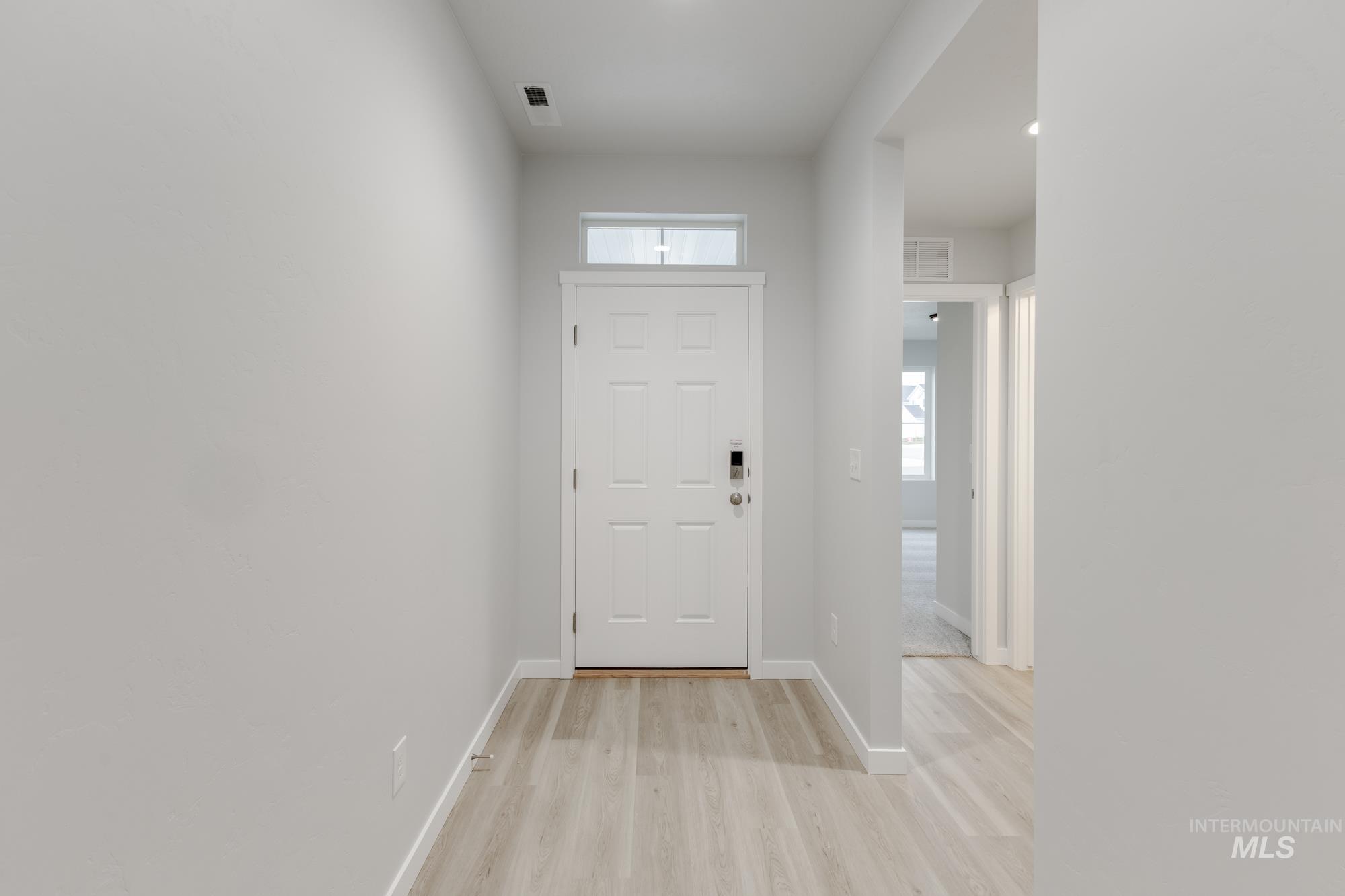16329 Fill Avenue Caldwell, ID 83607 - Photo 2 of 18 Entrance foyer with healthy amount of natural light and light wood finished floors
