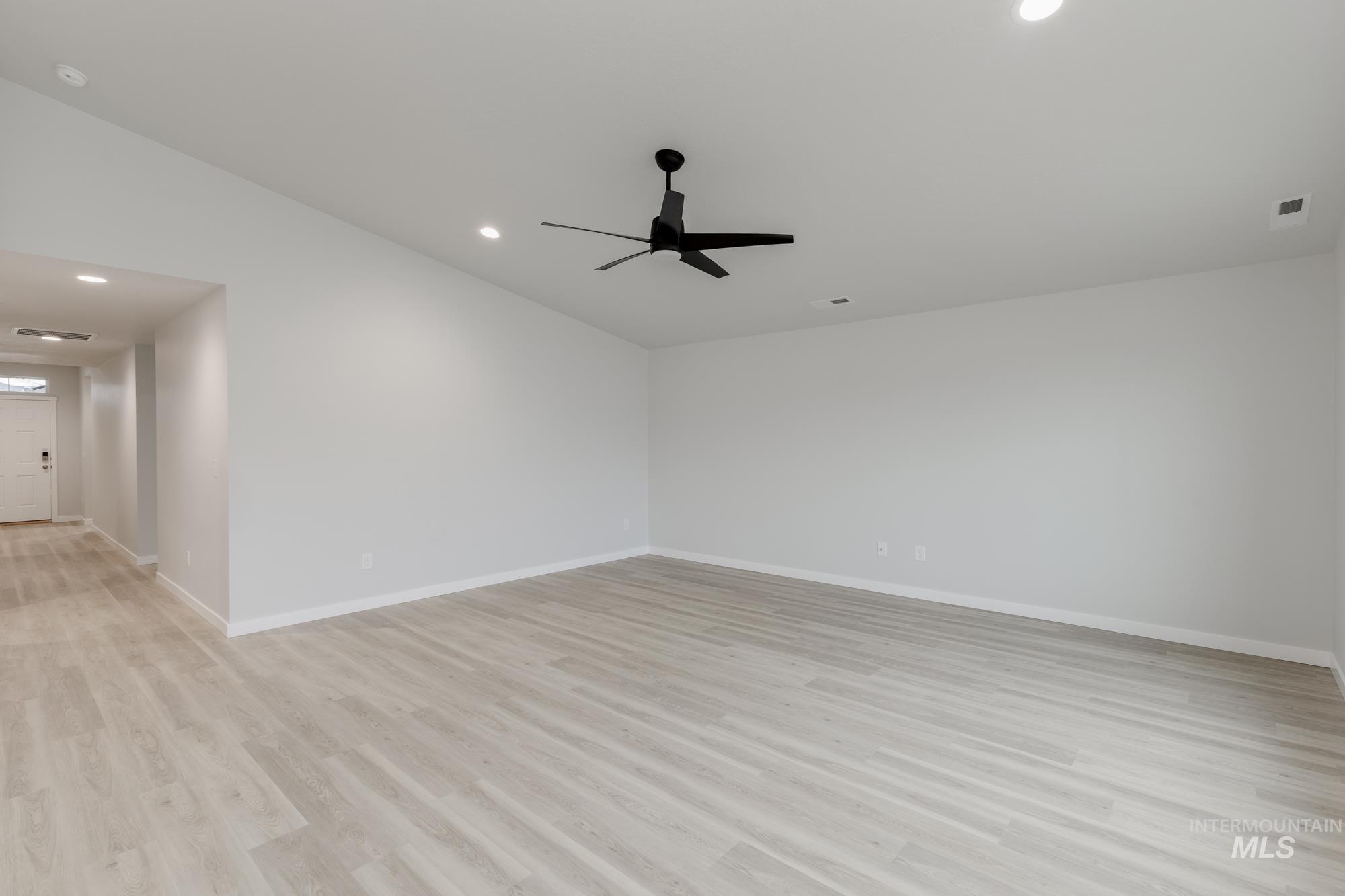 16329 Fill Avenue Caldwell, ID 83607 - Photo 8 of 18 Unfurnished room with recessed lighting, light wood-type flooring, vaulted ceiling, and ceiling fan