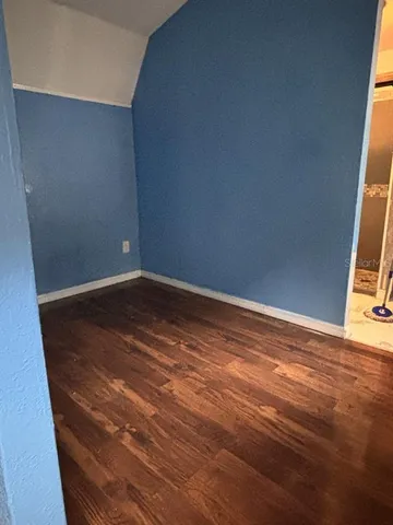 a bedroom with a bed and a table