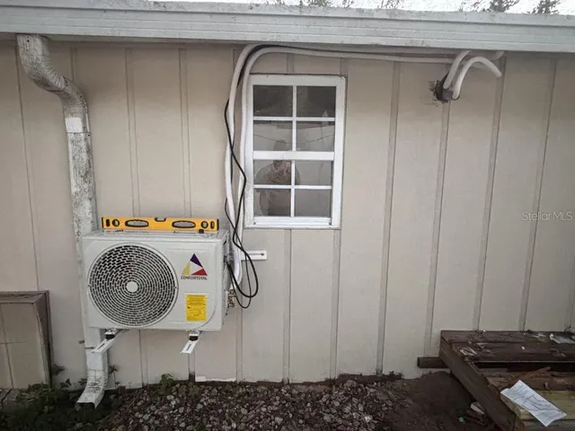 a room with a wooden floor and a window