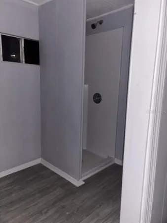a view of elevator with wooden floor