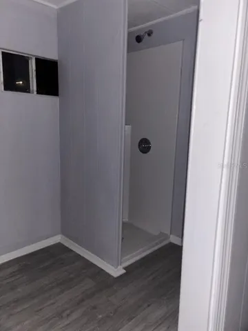 a view of elevator with wooden floor