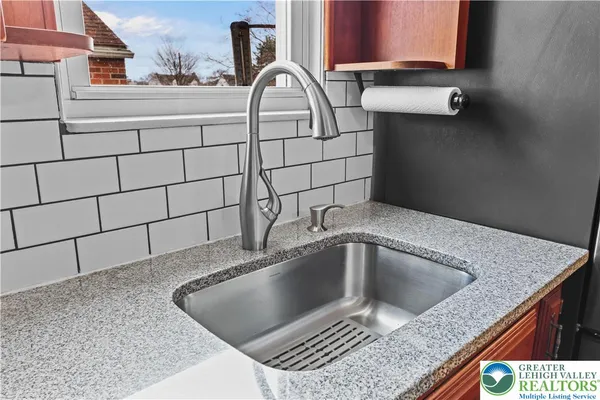 a kitchen with a sink and a window