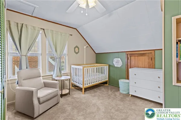 a bedroom with furniture and a window