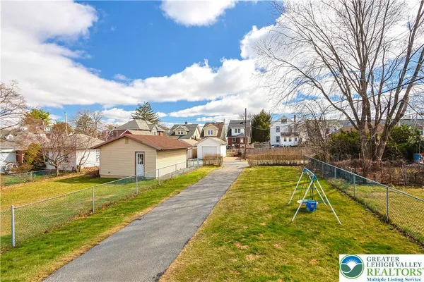 a view of a swimming pool with a patio
