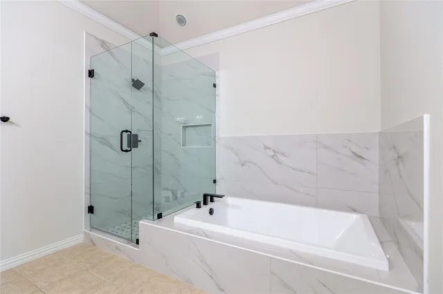 a bathroom with a bathtub and shower