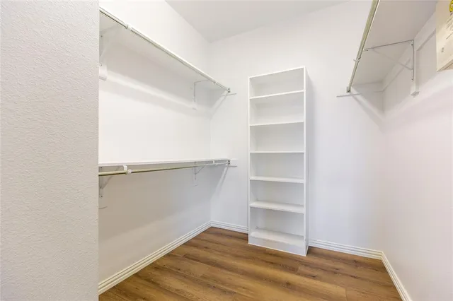a view of an empty walk in closet