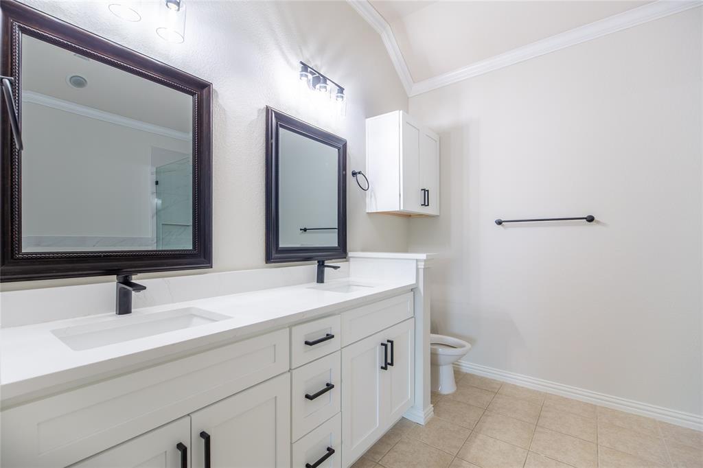 1020 Rodin Lane Carrollton, TX 75006 - Photo 13 of 25 a bathroom with a sink and a mirror